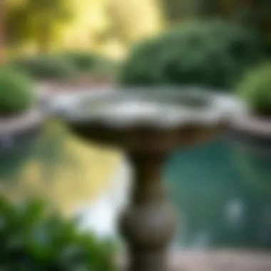 Elegant Toscano bird bath in a serene garden setting